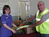 Lion Bill presenting the Harvest Festival Items